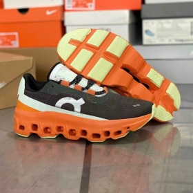 On Running Cloudmonster Black Orange